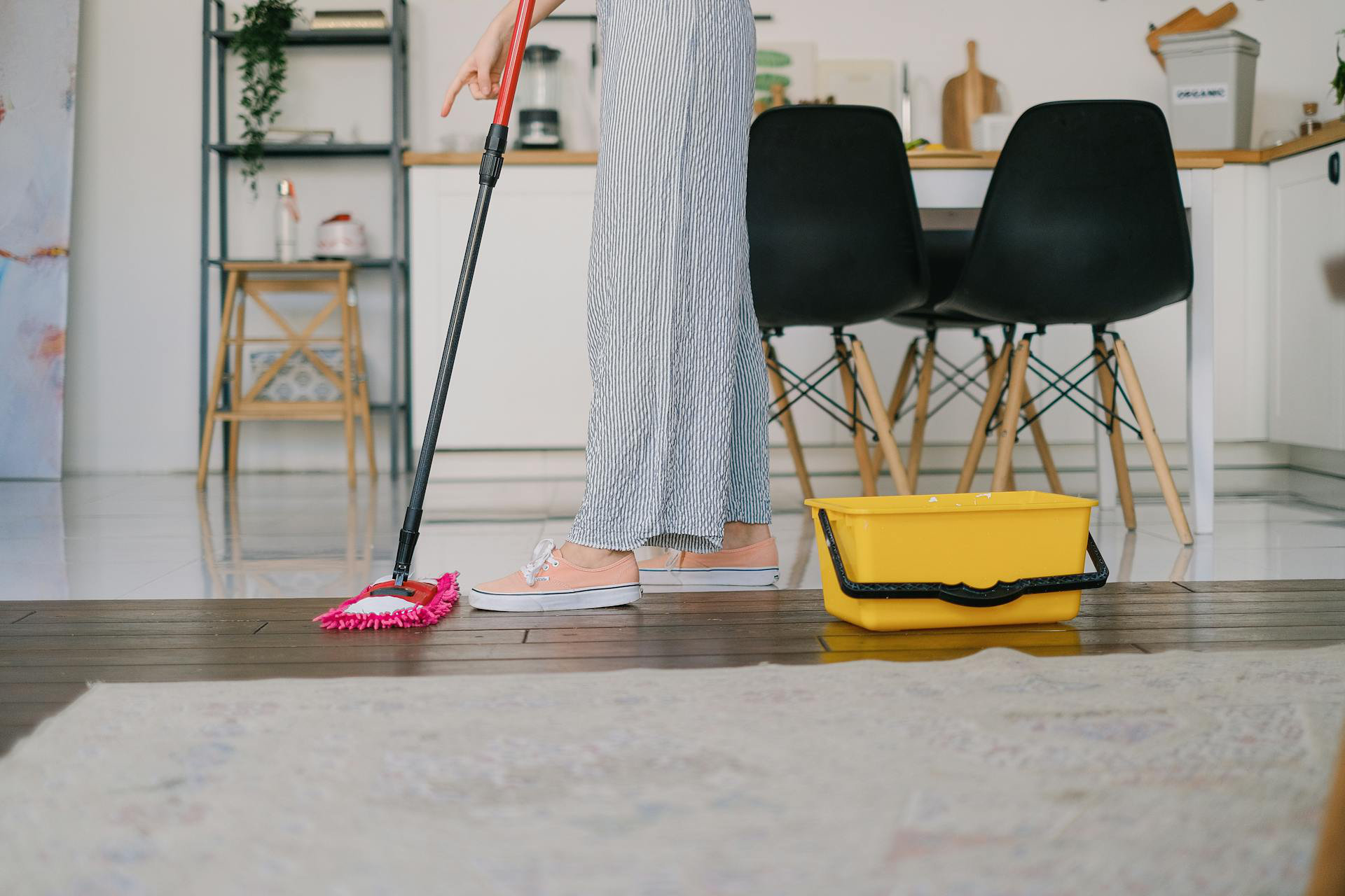 Person mopping wood floor
